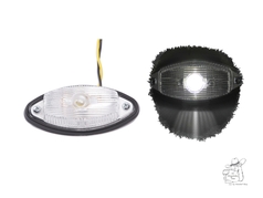 Klare Positionsleuchte mit schwarzem Sockel, in zwei Ansichten: unbeleuchtet und mit wei�em Licht leuchtend.