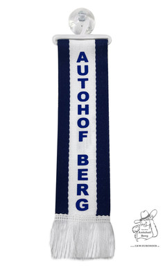 Minischal in Wei� und Dunkelblau mit Aufschrift "Autohof Berg", inklusive B�gel und Saugnapf.