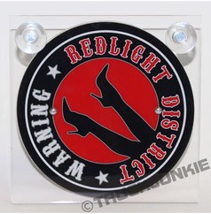 Runde schwarze Leuchtkasten-Platte mit rotem Kreis, Beinen in High Heels, Text 