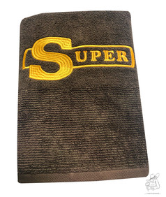 Braunes Duschtuch mit gelbem SUPER-Stick.