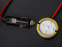 Beleuchtung f�r Poppy Lufterfrischer mit schwarzem Stecker und runder LED-Platine mit wei�en LEDs.