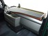 Gro�e Ablage f�r MAN TGX LKW, mit Holzoptik-Rand, rutschfester Oberfl�che und Spurassistent-Sensor im Innenraum.