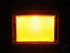 Rechteckige Lampe f�r Old School Sonnenblende, leuchtet hell orange. Front mit Gittermuster.