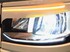 Leuchtender Scania NG Scheinwerfer mit wei�en Angel Eyes/B�ser Blick und orangefarbenem Blinklicht.