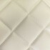 Cremefarbenes Kunstleder mit Rautensteppung, Dromader Line Waffel Meterware.